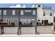 Modern townhome complex showcases garages, balconies, and sleek design, with individual AC units, under a bright sky at 3484 Orchard St, Atlanta, GA 30354