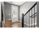 Inviting foyer with hardwood floors, gray walls, and a stylish mirror accent at 3484 Orchard St, Atlanta, GA 30354