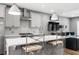 Modern kitchen with white cabinets, stainless appliances, a bar and seamless access to the living space at 3484 Orchard St, Atlanta, GA 30354