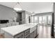 Bright, open kitchen featuring white countertops, stainless appliances, white farmhouse sink and gray cabinetry at 3484 Orchard St, Atlanta, GA 30354