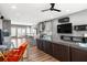 Open floor plan showing the living room and kitchen with wood floors and plenty of natural light at 3484 Orchard St, Atlanta, GA 30354