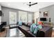 Cozy living room with a comfortable sectional sofa and lots of natural light from the large windows at 3484 Orchard St, Atlanta, GA 30354