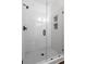 Modern shower with white subway tile, glass door, and sleek black hardware at 3484 Orchard St, Atlanta, GA 30354