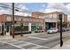 Street view featuring historic buildings, colorful murals, and a bustling atmosphere with parked cars at 3484 Orchard St, Atlanta, GA 30354