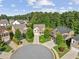 Aerial view of a cul-de-sac featuring well-manicured lawns and beautiful homes in a Gathering-friendly neighborhood at 3962 Roberts Crest Dr, Suwanee, GA 30024