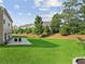 Expansive backyard featuring a large patio and landscaped areas, ideal for outdoor activities and relaxation at 3962 Roberts Crest Dr, Suwanee, GA 30024