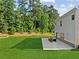 A spacious backyard with an outdoor seating area perfect for enjoying the serene surroundings at 3962 Roberts Crest Dr, Suwanee, GA 30024