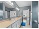 Bathroom featuring double sinks, neutral countertops, and modern fixtures at 3962 Roberts Crest Dr, Suwanee, GA 30024
