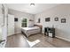 Bedroom featuring a bed, wood floors, and natural lighting at 3962 Roberts Crest Dr, Suwanee, GA 30024