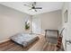 Minimalist bedroom with a bed on the floor, guitar and a desk at 3962 Roberts Crest Dr, Suwanee, GA 30024