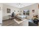 Well lit bedroom with desk, chair, bed, hardwood floors and natural light at 3962 Roberts Crest Dr, Suwanee, GA 30024