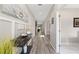 Elegant hallway featuring modern decor, stylish lighting, and pristine walls for a sophisticated ambiance at 3962 Roberts Crest Dr, Suwanee, GA 30024
