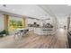 Open-concept kitchen with granite countertops, stainless appliances, and a breakfast nook overlooking the backyard at 3962 Roberts Crest Dr, Suwanee, GA 30024