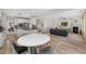 Open concept living area with a fireplace and wood floors, with an eat in kitchen area at 3962 Roberts Crest Dr, Suwanee, GA 30024