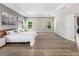 Spacious main bedroom with hardwood floors, recessed lighting, and natural lighting at 3962 Roberts Crest Dr, Suwanee, GA 30024