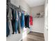 Walk-in closet with rod for hanging shirts and pants, plus shelves for organizing clothing at 3962 Roberts Crest Dr, Suwanee, GA 30024