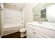 Bathroom featuring modern white vanity, matching toilet, and tub with shower at 6194 Golden Meadow Court Ct, Riverdale, GA 30296
