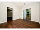 Open dining room featuring hardwood floors, chandelier, and backyard access at 6194 Golden Meadow Court Ct, Riverdale, GA 30296