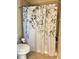Bathroom with decorative floral shower curtain and grab bar at 120 Chastain Nw Rd # 1803, Kennesaw, GA 30144