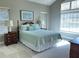 Spacious main bedroom with a vaulted ceiling and plenty of natural light at 120 Chastain Nw Rd # 1803, Kennesaw, GA 30144