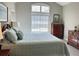 Comfortable main bedroom with a vaulted ceiling, dresser, and soothing décor at 120 Chastain Nw Rd # 1803, Kennesaw, GA 30144