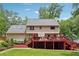 Home's exterior with a large wooden deck overlooking the backyard at 1438 Salem Dr, Alpharetta, GA 30009