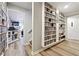 Finished basement with custom built-in bookshelves and hardwood floors at 1438 Salem Dr, Alpharetta, GA 30009