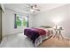 Charming bedroom featuring plush carpet, ceiling fan, and a large window at 1438 Salem Dr, Alpharetta, GA 30009