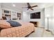 Bedroom with built-in shelving unit and a large TV at 1438 Salem Dr, Alpharetta, GA 30009