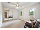 This bright bedroom has a ceiling fan, large window, and large closet at 1438 Salem Dr, Alpharetta, GA 30009