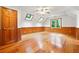 Spacious bonus room featuring beautiful hardwood floors, wood paneling, and skylights at 1438 Salem Dr, Alpharetta, GA 30009