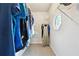 Carpeted walk-in closet with shelving and an octagon window to let in natural light at 1438 Salem Dr, Alpharetta, GA 30009