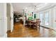 Sun-drenched dining area with views to the fireplace, backyard and built-in storage at 1438 Salem Dr, Alpharetta, GA 30009