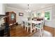 Elegant dining room with wainscoting, hardwood floors, and natural light at 1438 Salem Dr, Alpharetta, GA 30009