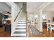 Bright home entryway featuring hardwood floors, staircase, and open access to living spaces at 1438 Salem Dr, Alpharetta, GA 30009