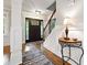 Inviting entryway with hardwood floors, stylish decor, staircase, and modern lighting fixtures at 1438 Salem Dr, Alpharetta, GA 30009