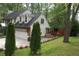 Charming home boasts a well-maintained lawn, attached garage and beautiful architectural details at 1438 Salem Dr, Alpharetta, GA 30009
