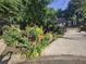 Beautifully landscaped front yard with lush flowers leads to a spacious home at 1438 Salem Dr, Alpharetta, GA 30009