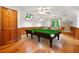 Attic game room with skylights, wood-paneled walls and a pool table for entertainment at 1438 Salem Dr, Alpharetta, GA 30009