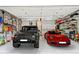 Spacious garage with two cars parked inside, offering ample storage and organization at 1438 Salem Dr, Alpharetta, GA 30009
