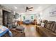 Cozy living room featuring a stone fireplace and comfortable furnishings for relaxing and entertaining guests at 1438 Salem Dr, Alpharetta, GA 30009
