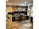 Office area with multiple monitors, bookshelves and a comfortable chair at 1438 Salem Dr, Alpharetta, GA 30009