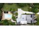 Aerial view of an estate featuring a pool, landscaped grounds, multiple buildings, and a driveway at 1656 N Pelham Ne Rd, Atlanta, GA 30324