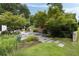 Beautiful backyard oasis with a stone water feature surrounded by lush landscaping and inviting stone pathways at 1656 N Pelham Ne Rd, Atlanta, GA 30324