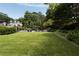 Large backyard with pool, lounge area, and lush landscaping at 1656 N Pelham Ne Rd, Atlanta, GA 30324
