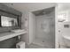 Modern bathroom featuring a sleek glass shower, tiled walls, and stylish fixtures at 1656 N Pelham Ne Rd, Atlanta, GA 30324
