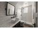 Modern bathroom with subway tile, glass shower, and stylish black fixtures at 1656 N Pelham Ne Rd, Atlanta, GA 30324