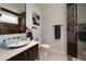 Stylish bathroom featuring a modern vanity, vessel sink, unique accent wall, and a sleek, minimalist design at 1656 N Pelham Ne Rd, Atlanta, GA 30324