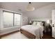 Cozy bedroom with a large window for natural light, a comfortable bed, and stylish decor at 1656 N Pelham Ne Rd, Atlanta, GA 30324