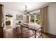 Elegant dining room features a wooden table, modern chairs, and natural light for sophisticated meals at 1656 N Pelham Ne Rd, Atlanta, GA 30324